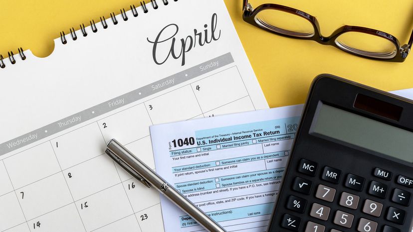 April calendar, calculator, 1040 form