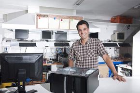 man with computer shop