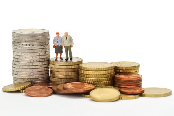 old couple standing on coins