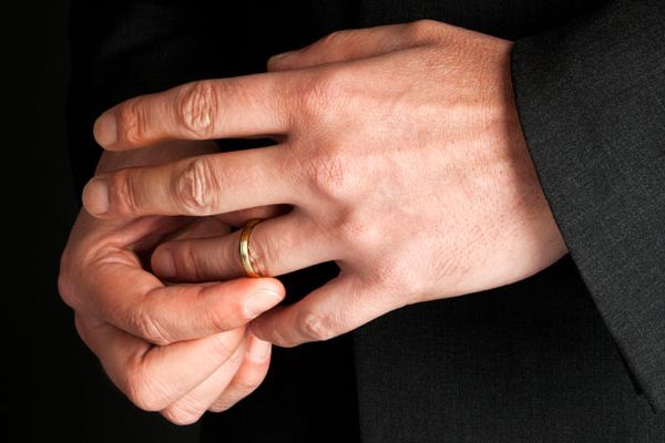 Man removing wedding ring