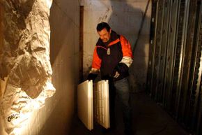 Housing developer Scott Chrisner demonstrates the ICF wall, special foam-insulation blocks with concrete poured inside.