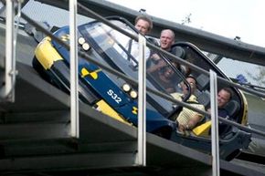 Four men riding on the Test Track ride at Disney's Epcot Center.