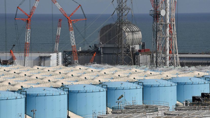 Nine years after the disaster at the Fukushima Daiichi nuclear plant, this picture, taken Feb. 3, 2020, shows the unit three reactor building and storage tanks for contaminated water at the Tokyo Electric Power Company (TEPCO) facility. KAZUHIRO NOGI/AFP/Getty Images