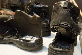 The shoes used in Richard Reid's failed attempt to blow up an airplane (R) are displayed with an FBI model of the shoe filled with explosives as part of an exhibit marking the 10th anniversary of the 9/11 attacks, at the Newseum in Washington, D.C.