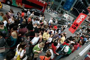 Customers line up at the TKTS booth to buy discounted theater tickets in New York. Hundreds of tourists and New Yorkers line up at the booth daily to buy same-day tickets to Broadway and off-Broadway shows.