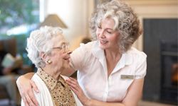 nursing home resident with caregiver