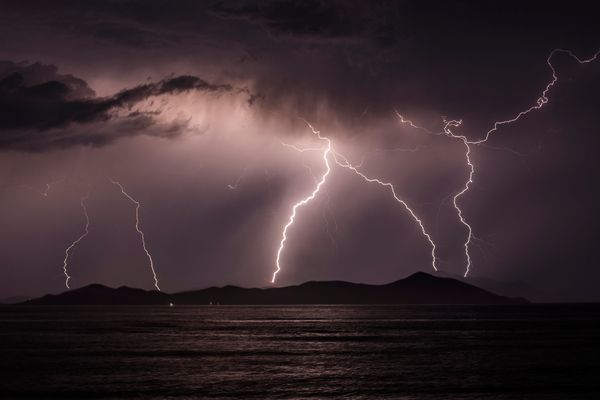 Lightning strikes over an island.