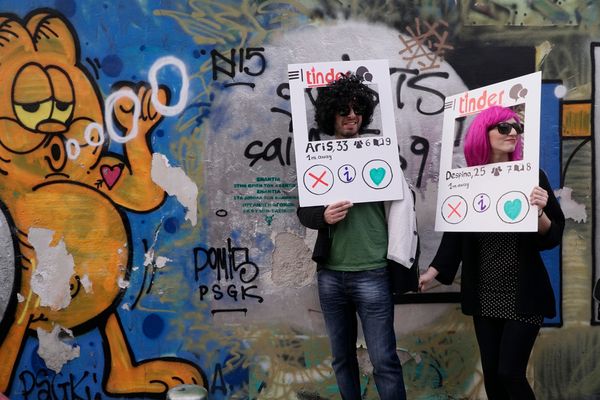 Couple dressed as Tinder application celebrate the carnival period in Metaxourgio in central Athens, on March 06, 2016.