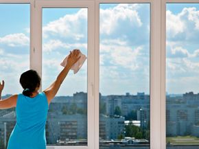 Person cleaning windows