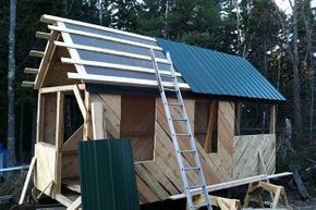 A roof goes up on a tiny house.