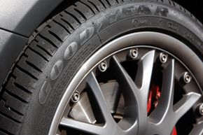 The Goodyear company logo is embossed into the sidewall of an Eagle RS-A tire mounted on a Mini Cooper S in the southeast Denver suburb of Greenwood Village, Colo.