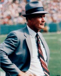 Tom Landry paces the sideline.                              In his mind, he's already a                                            half-dozen plays ahead of                                            the game on the field. See more pictures of football.