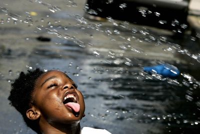 A girl in Harlem during a heat wave. 