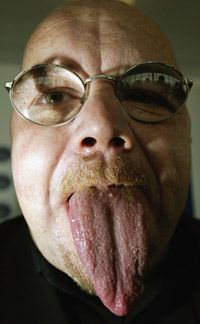 Guinness World Record holder Stephen Taylor displays his 3.74-inch-long tongue.