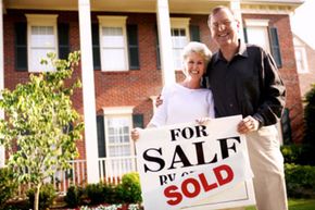 Retired couple by recently purchased home