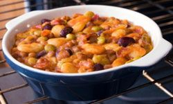 A casserole dish of a variety of baked beans.
