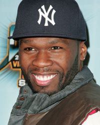 Rapper 50 Cent flashes that famous, trademark smile.