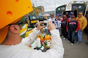 Fans tailgate before an NFL football game between the Green Bay Packers and the Buffalo Bills in Green Bay, Wis.