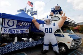 A large Colts inflatable player can be seen as fans tailgate in the parking lots outside of Lucas Oil Stadium prior to the preseason game between the San Francisco 49ers and the Indianapolis Colts in Indianapolis, Ind.