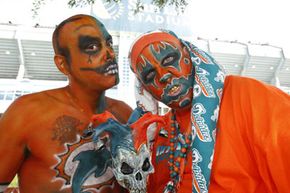 Manny Lopez (left) and Shane Meyers, members of the Dolphin Bandits, tailgate prior to the game between the Miami Dolphins and the New York Jets at Sun Life Stadium in Miami, Fla.