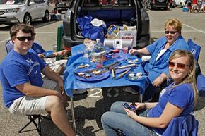 University of Kentucky fans, the Muldoons of Louisville, tailgate outside Cardinal Stadium in Louisville, Ky., before the start of the Kentucky-Louisville NCAA college football game.