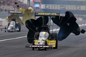 Top Fuel dragsters use two parachutes to slow the car after a blistering high-speed pass.