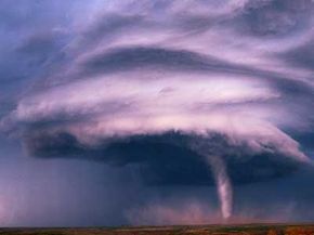 A tornado descends from the mesocyclone of a thunderstorm over New Mexico.
