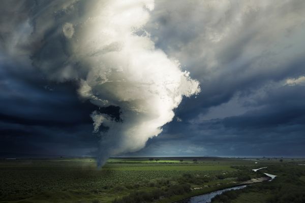 Illustration of tornado near a river