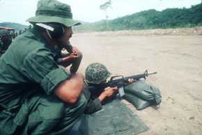 An unidentified American official trains Honduran soldiers in June 1983.