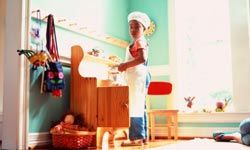 girl with toy kitchen