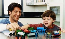 father and son with train set
