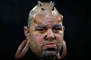 Kala Kaiwi, a body mod artist from Hawaii, poses at the 2015 Venezuela Expo Tattoo. Among other mods, Kaiwi sports transdermal and subdermal implants, a split tongue, various piercings and tattoos and oh yeah, he's the world record holder for the largest non-surgically made stretch earlobes.