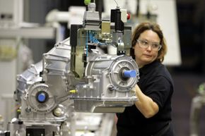 Transmissions Image Gallery Donna Ramsey moves transmissions in the final assembly area at the General Motors Willow Run plant in Ypsilanti, Mich., on Oct. 26, 2005. See more pictures of transmissions.