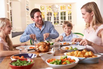 Young family having dinner