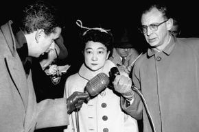 Iva Toguri d’Aquino looks overwhelmed while being interviewed by journalists before her trial. She had told them she was Tokyo Rose in hopes of collecting an interview fee, little realizing this would lead to her arrest and imprisonment.