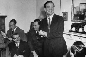 Kim Philby jokes with newsmen at his mother's home during a 1955 press conference after being formally cleared of tipping off Guy Burgess and Donald Maclean that British intelligence was on to them. Philby later resigned from MI6, but agents interrogated him about this again in 1963. As they closed in, he escaped to Russia.