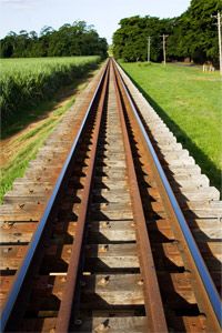 The ties in these train tracks near Queensland, Australia, are wooden, and the rails stretching into the distance look to be made of steel.