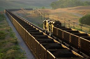 This Wyoming freight train's open-topped ore cars are filled with coal, a common load for freight railroads.