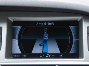 This Audi multimedia interface screen displays Travolution information for drivers. If they maintain a speed of 31 mph (50 kph), then they'll coast through a green light -- even if the light is currently red.