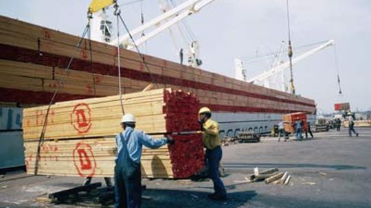 How does pressure-treated lumber work?