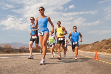 Athlete running outdoors in sports race.