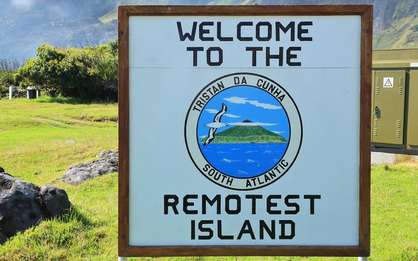 Sign posts a majestic mountain in natural outdoorsy landscape.