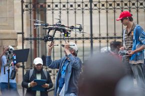 A journalist operates a drone outside the Pretoria High Court on in Pretoria, South Africa during the trial of Oscar Pistorius.