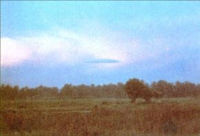 This lenticular cloud was photographed over Kepala Batas, Malaysia, in November 1984. Many UFO sightings can indeed be explained as natural occurrences.