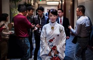 Jia Jia, an android, stands in front of a group of people.