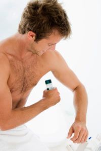 man using deoderant