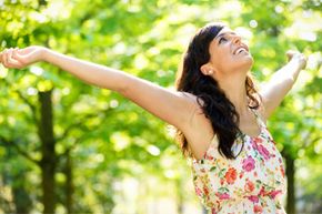 Woman raising her arms