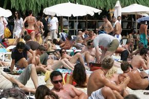 Hot humid places, like this beach in Ibiza, Spain, are a perfect breeding ground for sweat rash. View more men's health pictures.