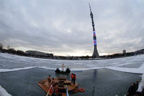 People gather to immerse themselves in an ice hole near the Ostankino television tower during celebrations for Russian Orthodox Epiphany in Moscow, 2015. A similar radio tower north of Moscow transmitted strange beeps and buzzes in the 1980s and '90s.