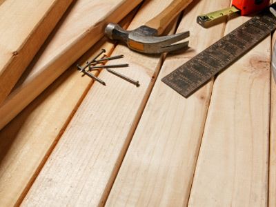 Various tools sitting on fresh new lumber